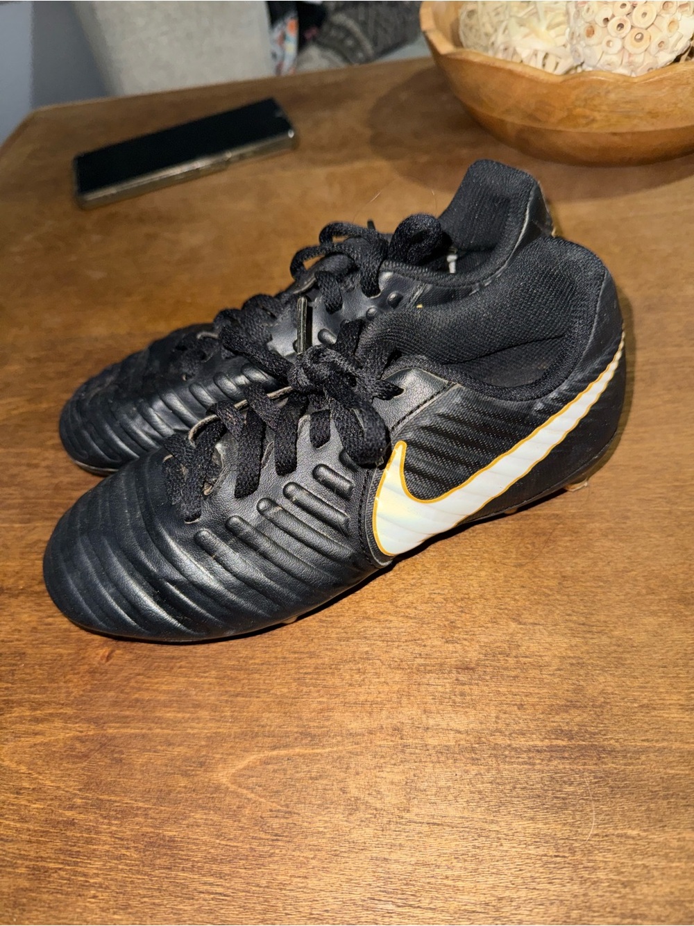 Nike Kids Black Soccer Sneakers with White and Gold Swoosh